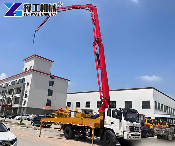 Concrete placing boom truck on site