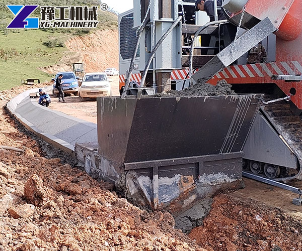Curb and gutter machine for roads